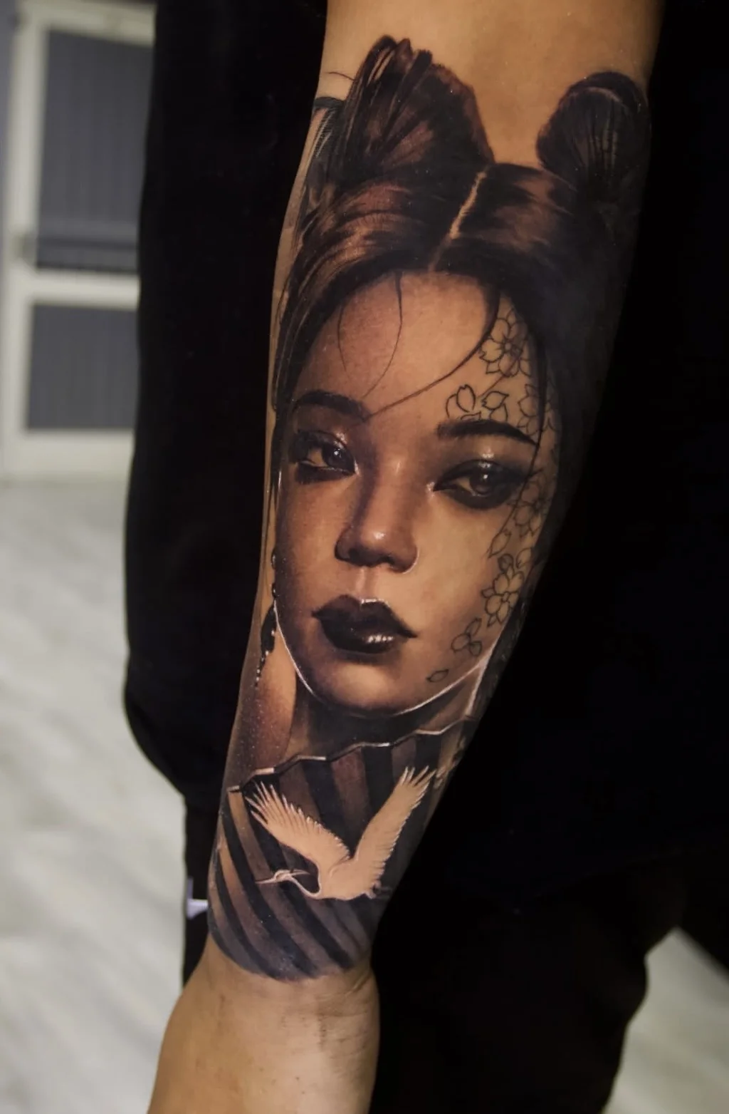 Detailed black and grey sleeve work on an arm